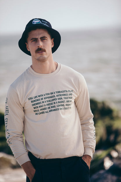 Model with mustache wearing a long sleeve t-shirt on the beach with a Jacob Foppens Van Es print on it